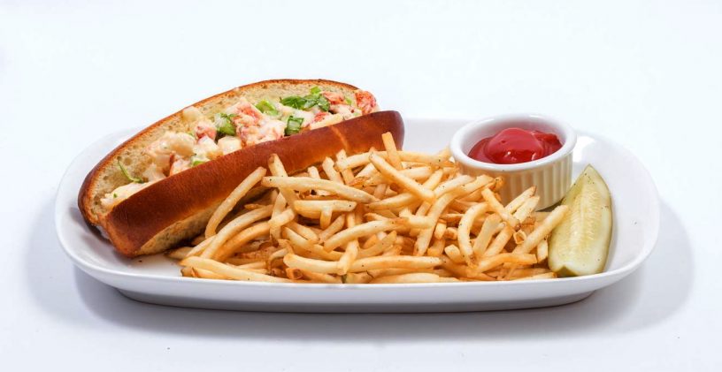 Lobster roll, fries, pickle.