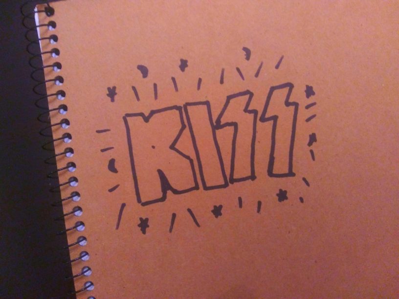 Scrawled Kiss logo.